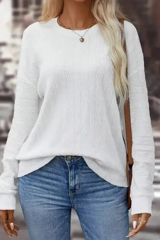 White Round Neck Drop Shoulder Textured Knit Top - Long worn with denim, showcasing its drop shoulder design and fall-ready knit fabric.