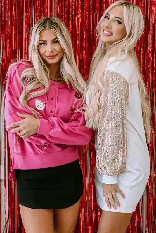 White Sequin Puff Sleeve Dress styled for a holiday look, paired with a pink festive top and red backdrop.