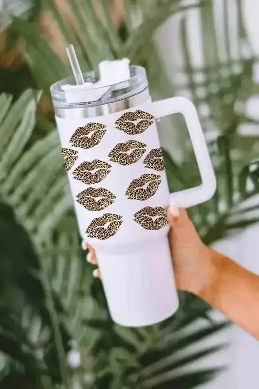 1200ml White Leopard Lips Thermos Cup with Valentine print and handle, shown against tropical green leaves background for stylish drinkware appeal.