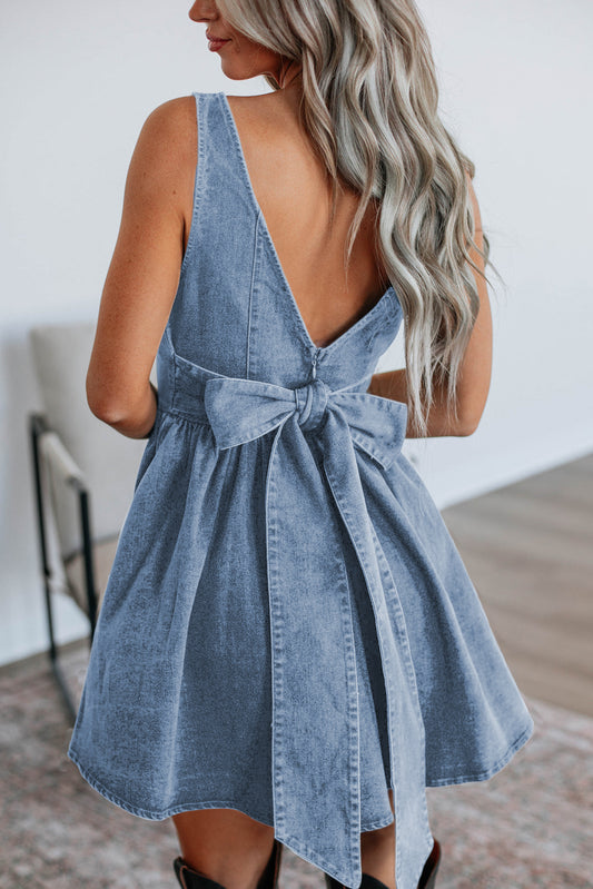 Stylish women's bowknot denim dress featuring a v-back design and flared skirt