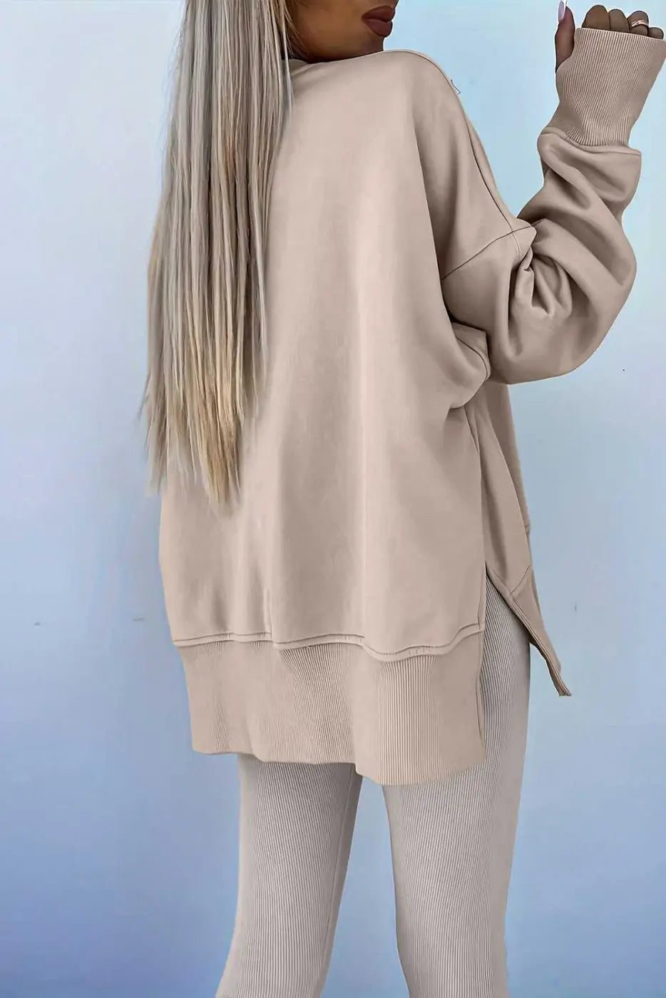 Back view of beige Oversized Sweatshirt and Leggings Matching Set, emphasizing the oversized silhouette and ribbed knit leggings.
